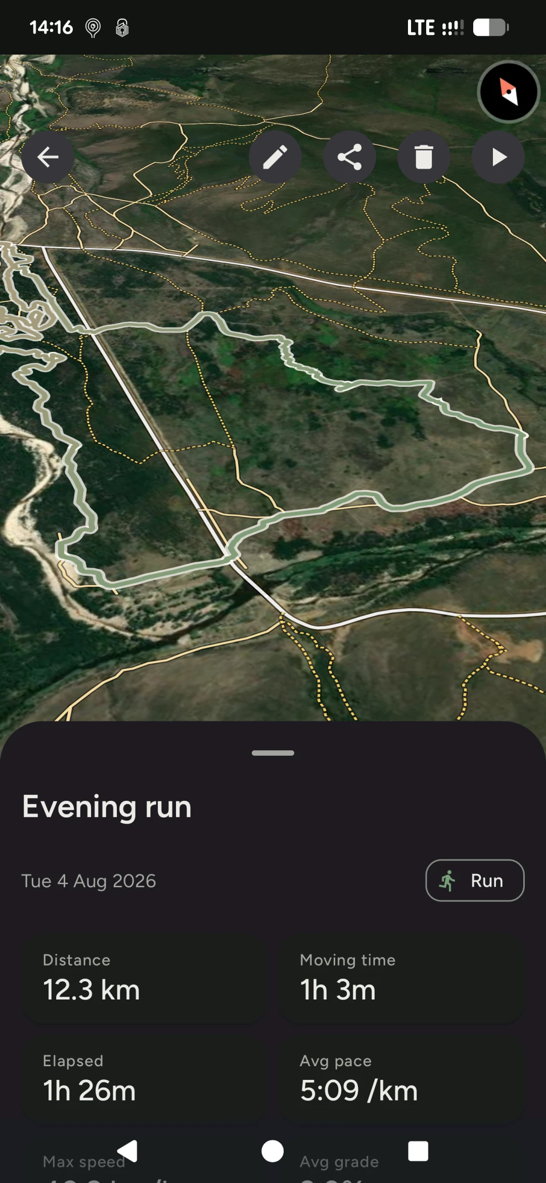 A recorded 12.3 km run in TrailFree, the route drawn as a loop over satellite imagery with the surrounding trail network marked